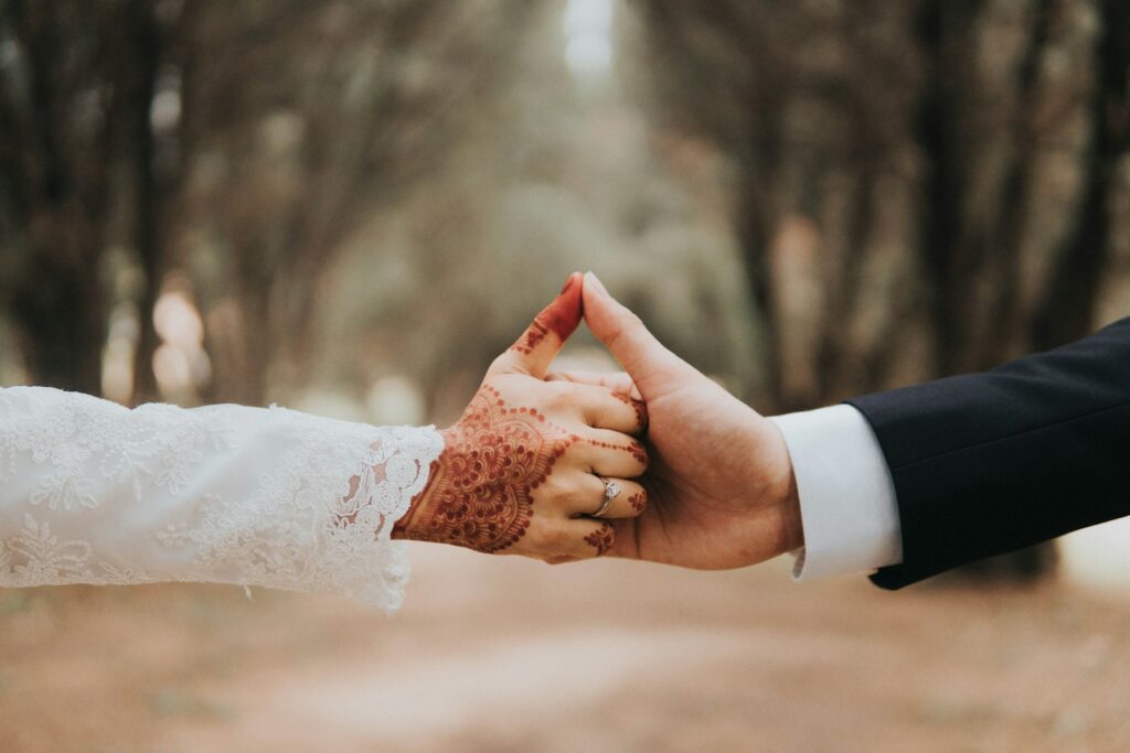man and woman holding hands