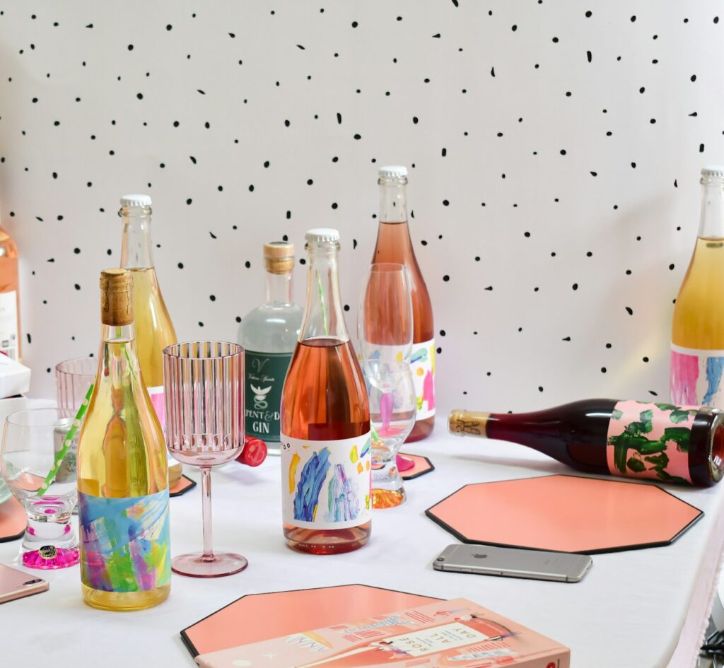 a table topped with lots of bottles of wine