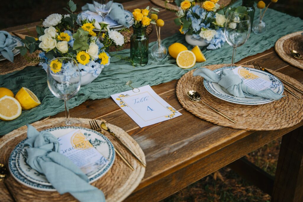 Table setting with lemons and floral arrangements.