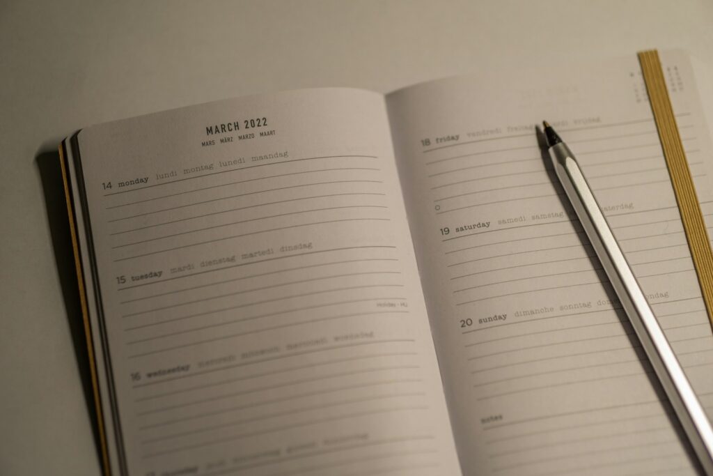 a notebook with a pen and a notebook