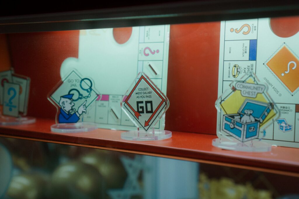 Monopoly game pieces on a shelf