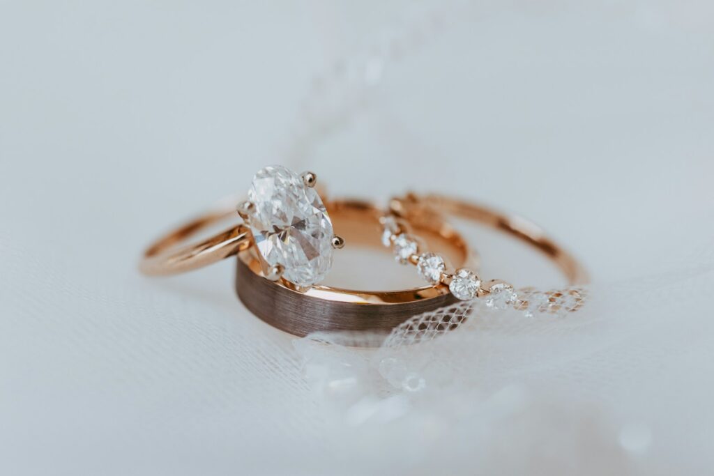 A couple of wedding rings sitting on top of a table