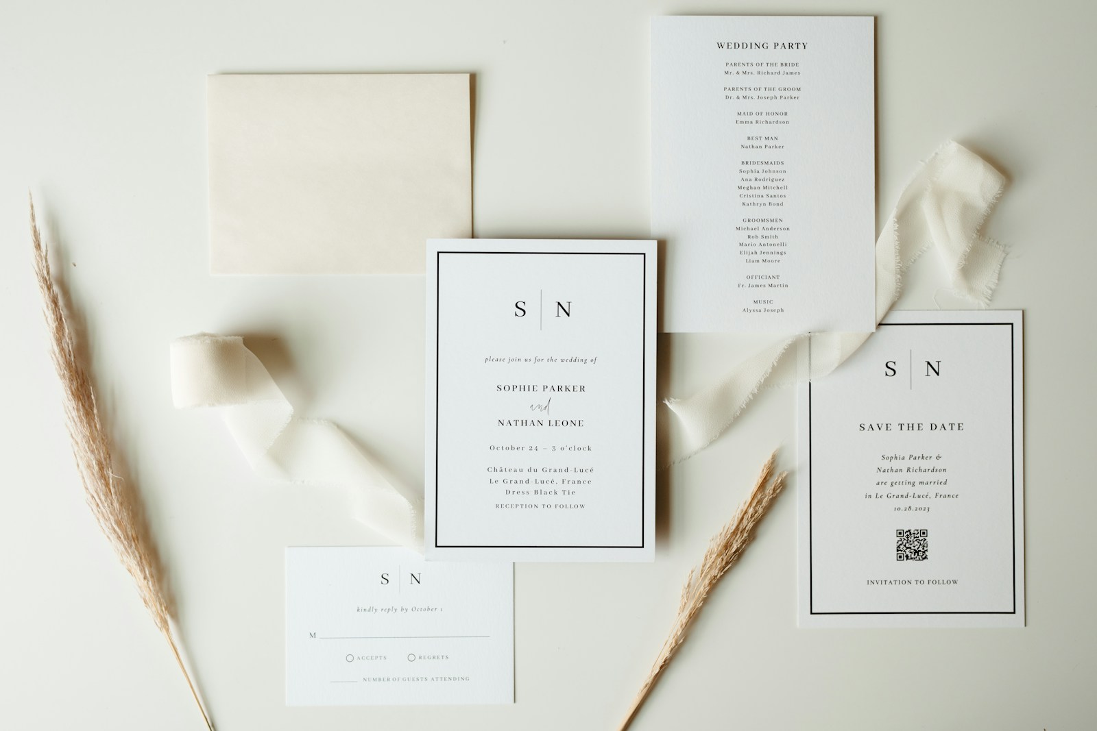 Wedding stationery suite with neutral ribbon and dried flowers.
