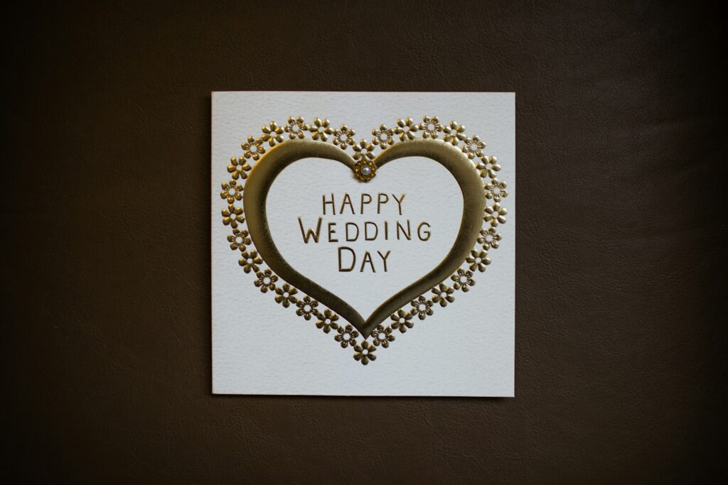 white happy wedding day card on brown surface