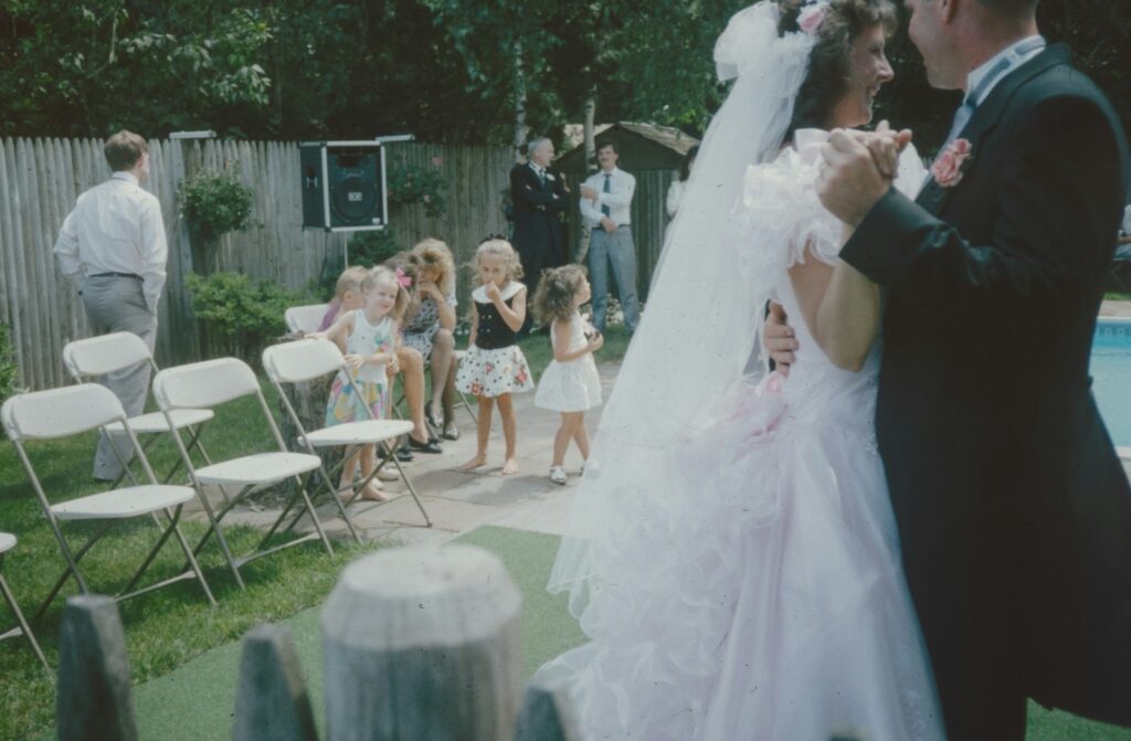 a bride and groom walking down the aisle