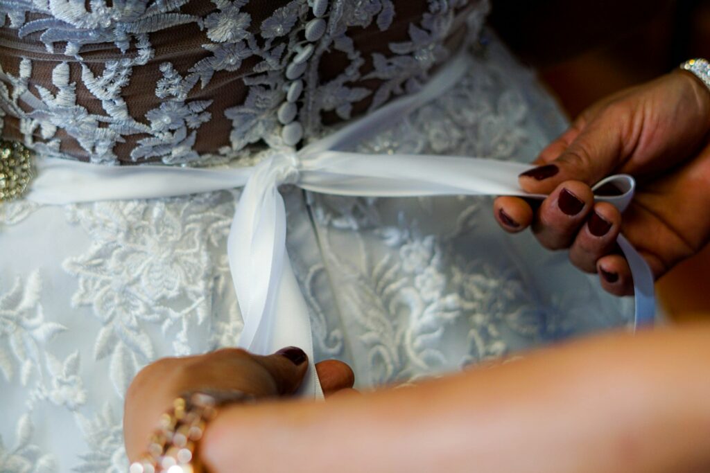 bride trying wedding dresses